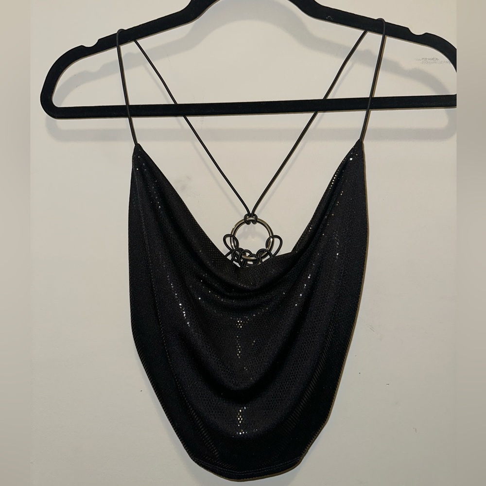 Slight shimmer strappy top, open back with silver ring.